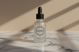 ELARA Retinol Night Oil on glossy reflective marble surface