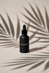 ELARA Ceramide Repair Serum with dramatic leaf shadow pattern