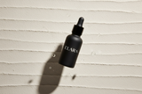 ELARA Ceramide Repair Serum floating bottle dramatic shot