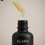 ELARA Scalp Therapy Hair Oil macro shot of golden oil droplet